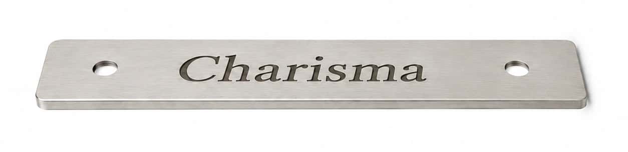 Photographed silver-coloured plate engraved with Charisma in the straight font
